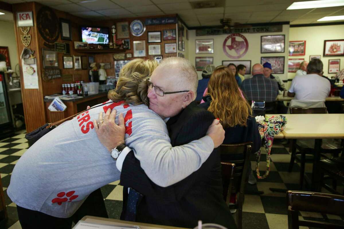 Wearing a Katy High School shirt, Jenifer Stockdick, left, a sixth generation Katy resident, hugged then-mayor Fabol Hughes, at Snappy's Cafe and Grill as the city of Katy prepared to send the team back to play for another title in the 6A, Division II state high school football in 2015. Hughes stepped down as mayor in May 2017.
