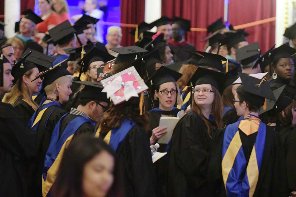 Graduates look around after processing in at the Schenectady County Community College commencement ceremony at Proctors on Thursday, May 18, 2017, in Schenectady, N.Y. (Paul Buckowski / Times Union)