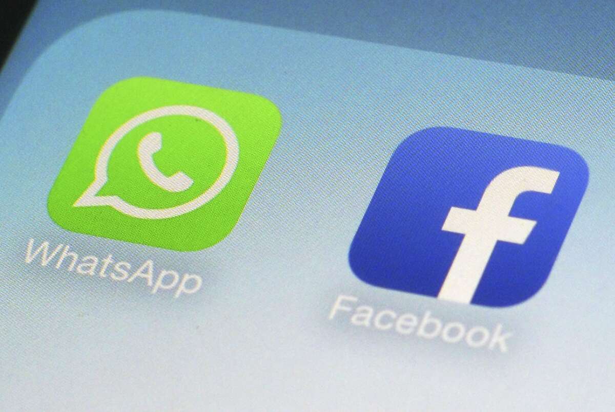 This Feb. 19, 2014, file photo, shows WhatsApp and Facebook app icons on a smartphone in New York.