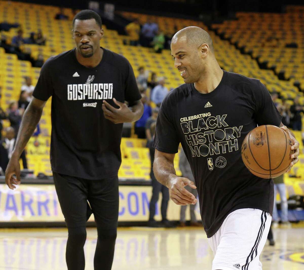 Spurs assistant coach Ime Udoka works out with Dewayne Dedmon before Game 2 of the Western Conference finals against the Golden State Warriors on May 16, 2017 at Oracle Arena in Oakland, Calif.