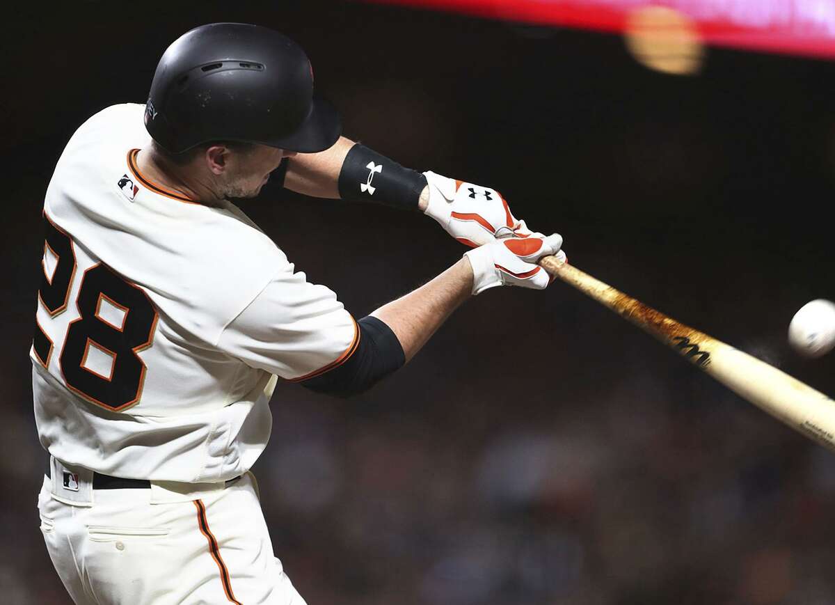 Buster Posey connects for a home run against the Dodgers on Monday night, one of six he’s hit this month.