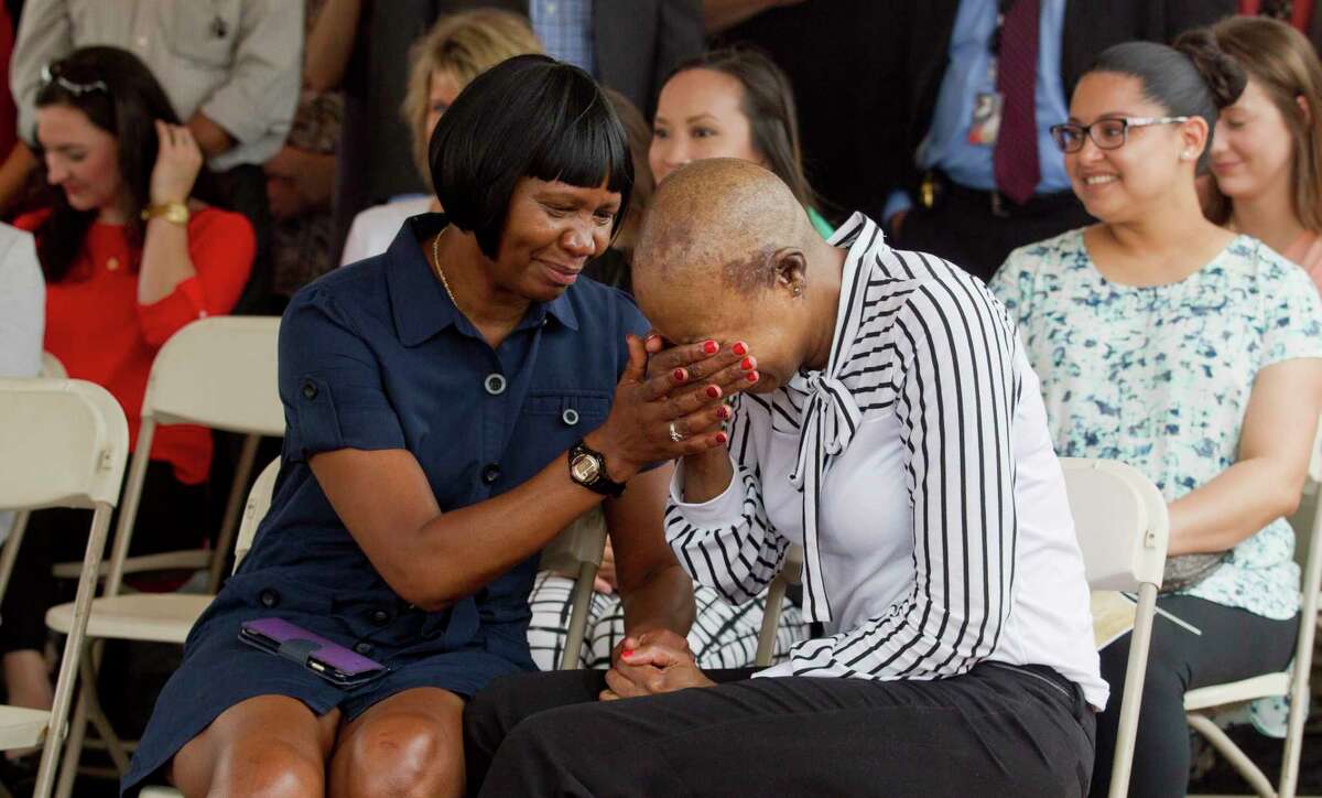 U.S. Army Sergeant First Class Demitra Jarrett, right, is comforted by her mother Gloria after being awarded new custom, mortgage-free home through Operation Finally, an organization that supplies homes to veterans and their families, in the Woodforest subdivision, Thursday, May 18, 2017, in Montgomery. Demitra suffered a traumatic brain injury while serving in Iraq in 2003.