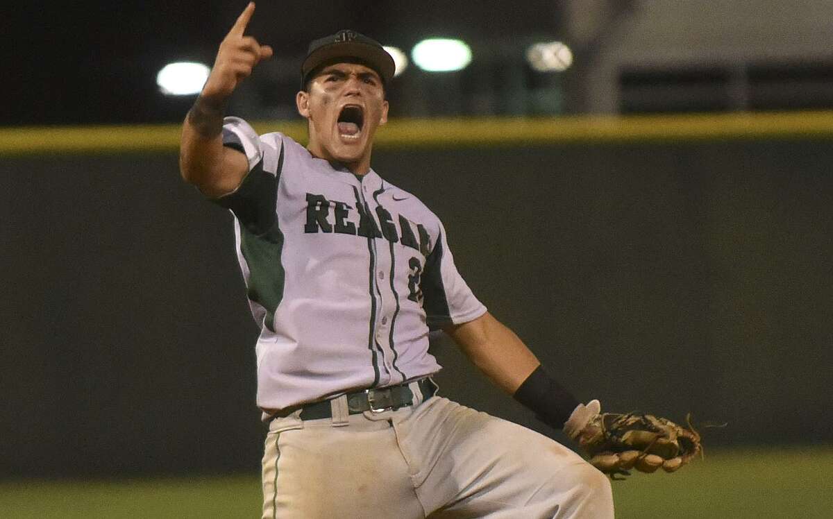 Reagan shortstop Ramon Garza celebrates after catching the final out in a 7-2 win over Johnson in Game 1 of the Class 6A third-round playoff series on May 18, 2017.
