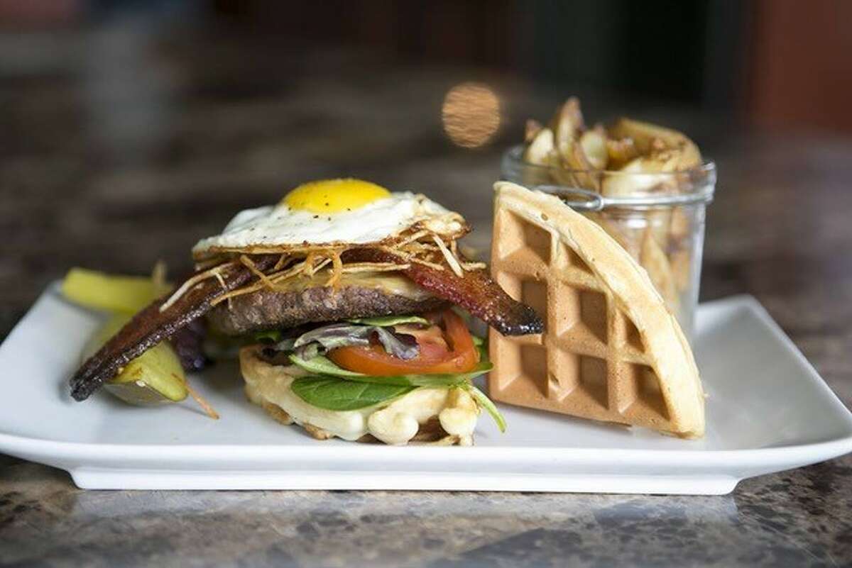 The Morning After Burger, compliments of Chef Shannen Tune and his Craft Burger Food Truck. This upscale, chef driven burger incorporates hormone - and antibiotic-free beef, in addition to candied bacon, crispy potato hash, a sunny-up egg, smoked gouda and a bacon-cheddar waffle.