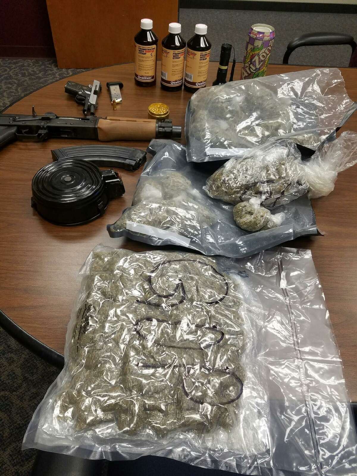 Jefferson County Sheriff's Office detectives arrested three men on drug charges and confiscated a loaded assault rifle and pistol during an investigation Thursday.