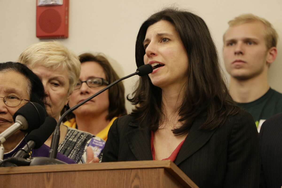 Democratic Rep. Jessyn Farrell of Seattle speaks at a news conference before a hearing on a bill to raise the state's minimum wage to $12 an hour over the next four years, Monday, March 30, 2015, in Olympia, Wash. Farrell is sponsor of the bill that has passed the House and is being considered by the Senate, and would add a series of 50-cent increases to the current $9.47 state hourly minimum wage. (AP Photo/Rachel La Corte)