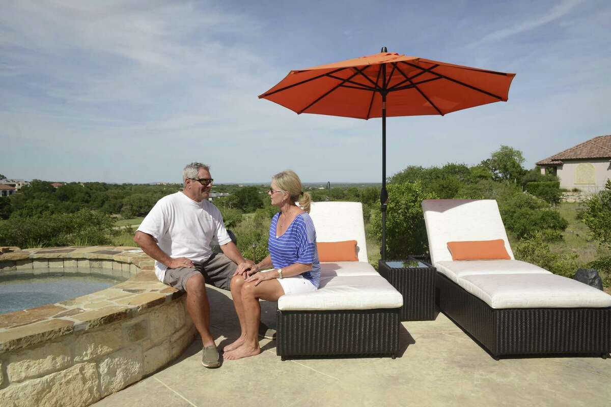 Rod and Paula Alexander relax by their pool at their home at Cordillera Ranch. They say that although they live in an affluent community, the residents are humble and friendly. They moved to the Hill Country community from the Texas Panhandle.