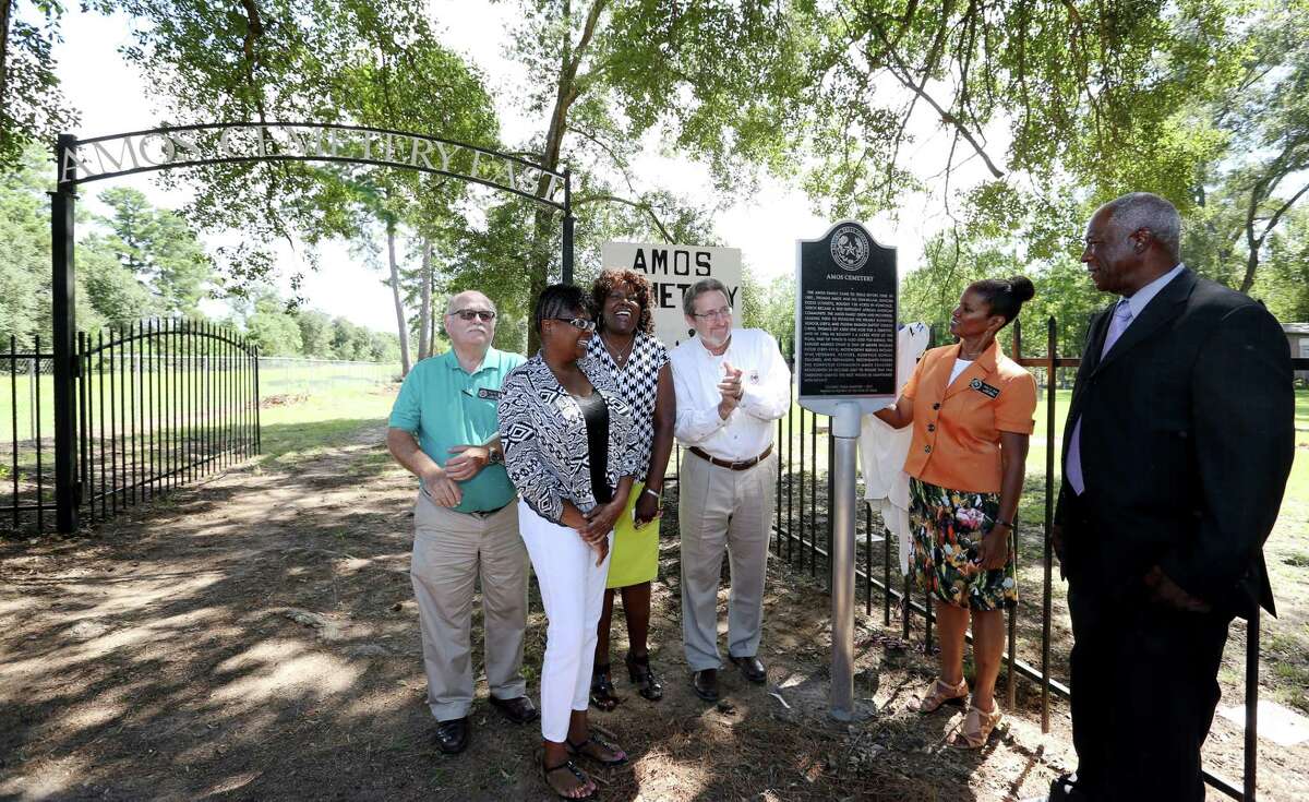 Pilgrim Branch Baptist Church members gather to unveil the official Texas Historical Marker at their Amos Cemetery Saturday, Sept. 24, 2016, in Houston. Special guests are (from left): Paul R. Scott from Harris County Information Technology Center, Joanne Green and Cathyrine Stewart of Kohrville Community Amos Cemetery Association Committees, Mark Seegers representing Harris County Precinct 4 commissioner, Debra Blacklock-Sloan from Harris County Historical Commission and Pastor Freddie Solomon with Carverdale Community Church of God in Christ. (Yi-Chin Lee / Houston Chronicle )