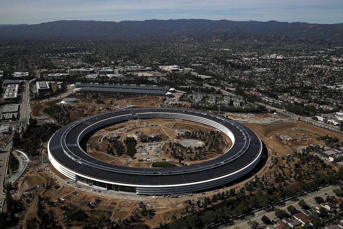 CUPERTINO, CA - APRIL 28: An aerial view of the new Apple headquarters on April 28, 2017 in Cupertino, California. Apple's new 175-acre 'spaceship' campus dubbed "Apple Park" is nearing completion and is set to begin moving in Apple employees. The new headquarters, designed by Lord Norman Foster and costing roughly $5 billion, will house 13,000 employees in over 2.8 million square feet of office space and will have nearly 80 acres of parking to accommodate 11,000 cars. (Photo by Justin Sullivan/Getty Images)