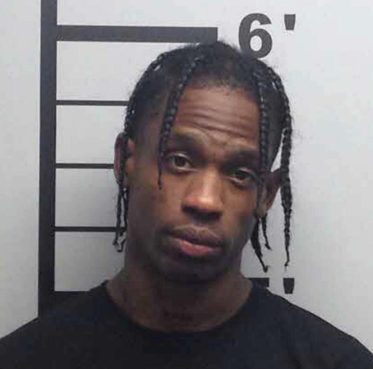 Travis Scott This undated photo provided by the Benton County Sheriff's Office in Bentonville Ark., shows the wrapper, whose real name is Jacques Webster, after he was arrested on May 13, 2017, on charges of inciting a riot, disorderly conduct and endangering the welfare of a minor.  (Benton County Sheriff's Office via AP)