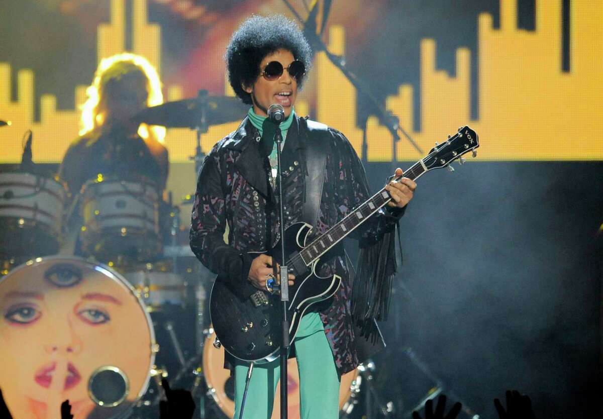 FILE - In this May 19, 2013, file photo, Prince performs at the Billboard Music Awards at the MGM Grand Garden Arena in Las Vegas. In a ruling made public Friday, May 19, 2017, a Minnesota judge ruled that Prince's six siblings are the heirs to his estate, more than a year after the pop superstar died of a drug overdose. (Photo by Chris Pizzello/Invision/AP, File)