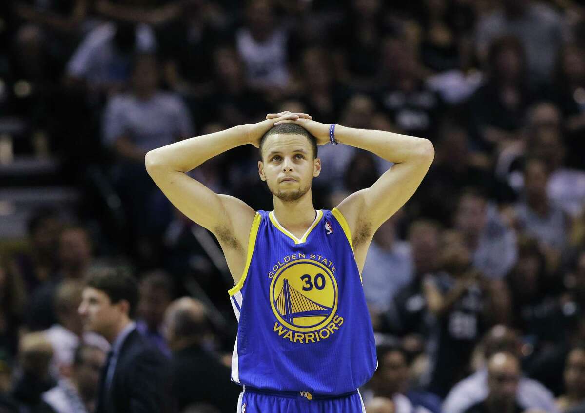 Golden State Warriors' Stephen Curry pauses during time out against the San Antonio Spurs during the first half in Game 5 of a Western Conference semifinal NBA basketball playoff series, Tuesday, May 14, 2013, in San Antonio. (AP Photo/Eric Gay)