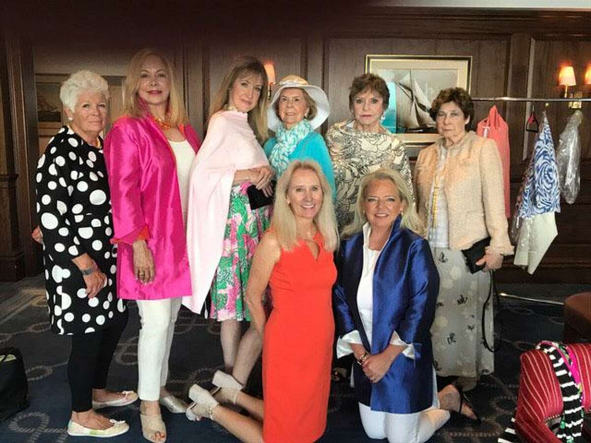 Members of the Women's Club of Greenwich at the Annual Luncheon and Fashion Show strike a pose with Nancy Wasche (pictured bottom right), owner of PINKY of Greenwich.