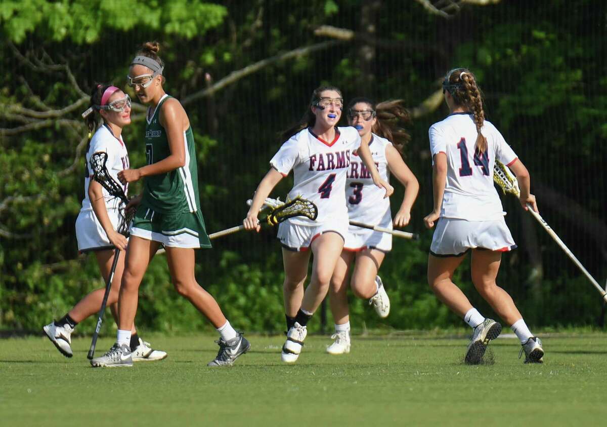 Members of Greens Farms celebrate a goal by Kate Paliotta (4) during the FAA Girls Championship game against Sacred Heart Greenwich at Sacred Heart Greenwich on May 19, 2017 in Greenwich, Connecticut.