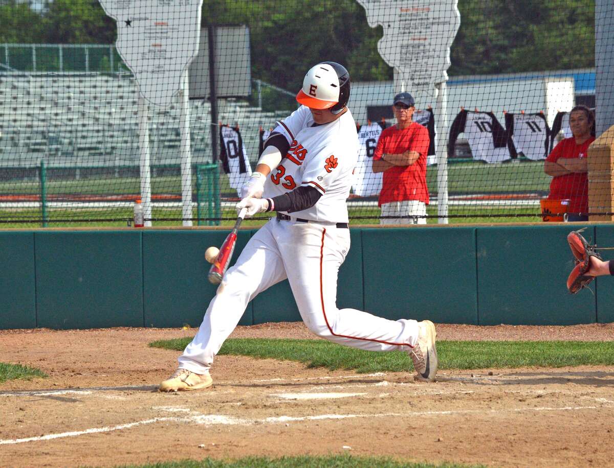 Edwardsville freshman Drake Westcott connects with a pitch for a two-run double in the third inning on Friday in the first game of a doubleheader against Triad at Tom Pile Field.