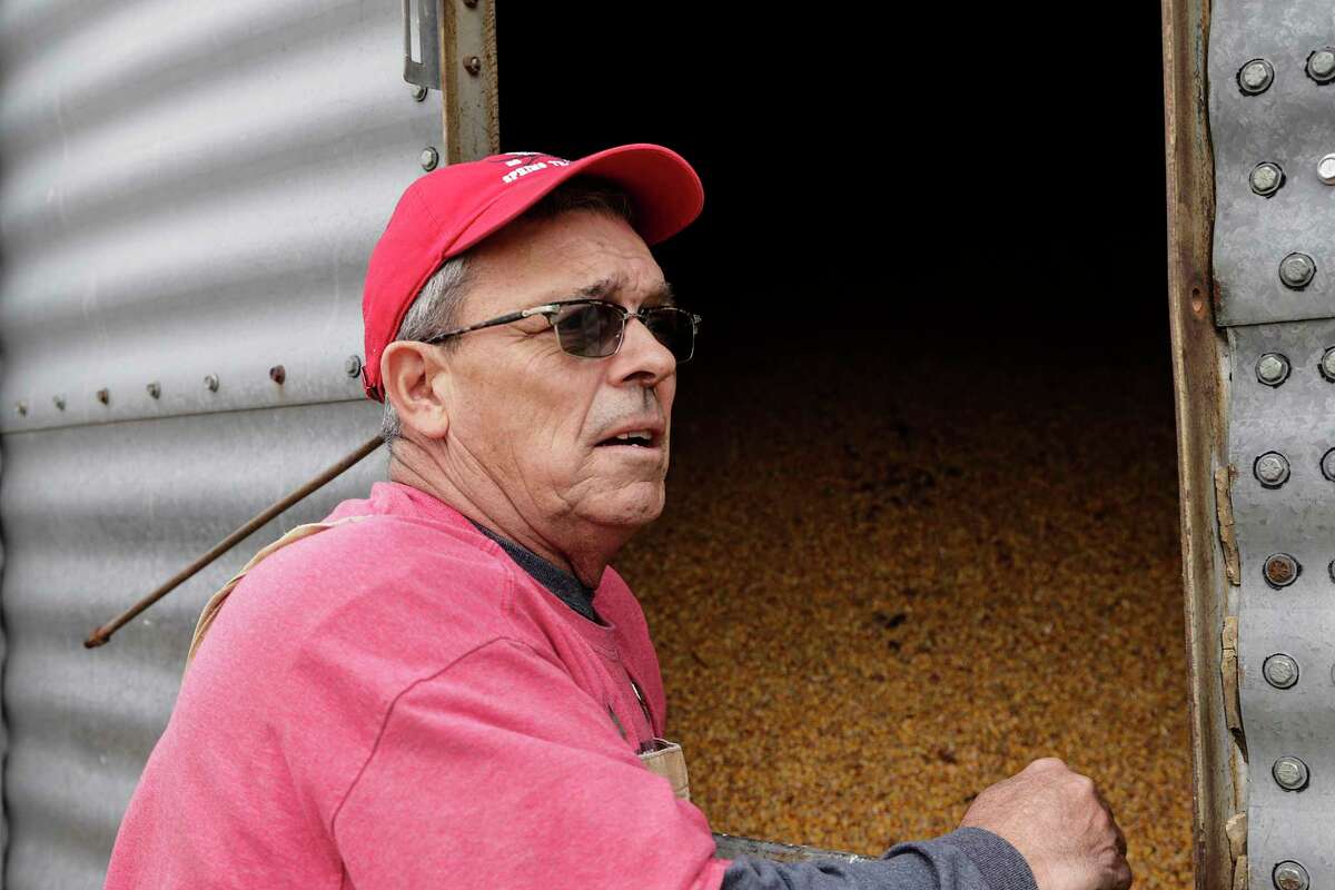 In this Tuesday, April 4, 2017, photo, Blake Hurst, a corn and soybean farmer and president of the Missouri Farm Bureau, stands by a corn silo on his farm in Westboro, Mo. U.S. President Donald Trump has vowed to redo the North American Free Trade Agreement, but NAFTA has widened access to Mexican and Canadian markets, boosting U.S. farm exports and benefiting many farmers. Hurst says NAFTA has been good for his business and worries that he'll lose out in a renegotiation. (AP Photo/Nati Harnik)