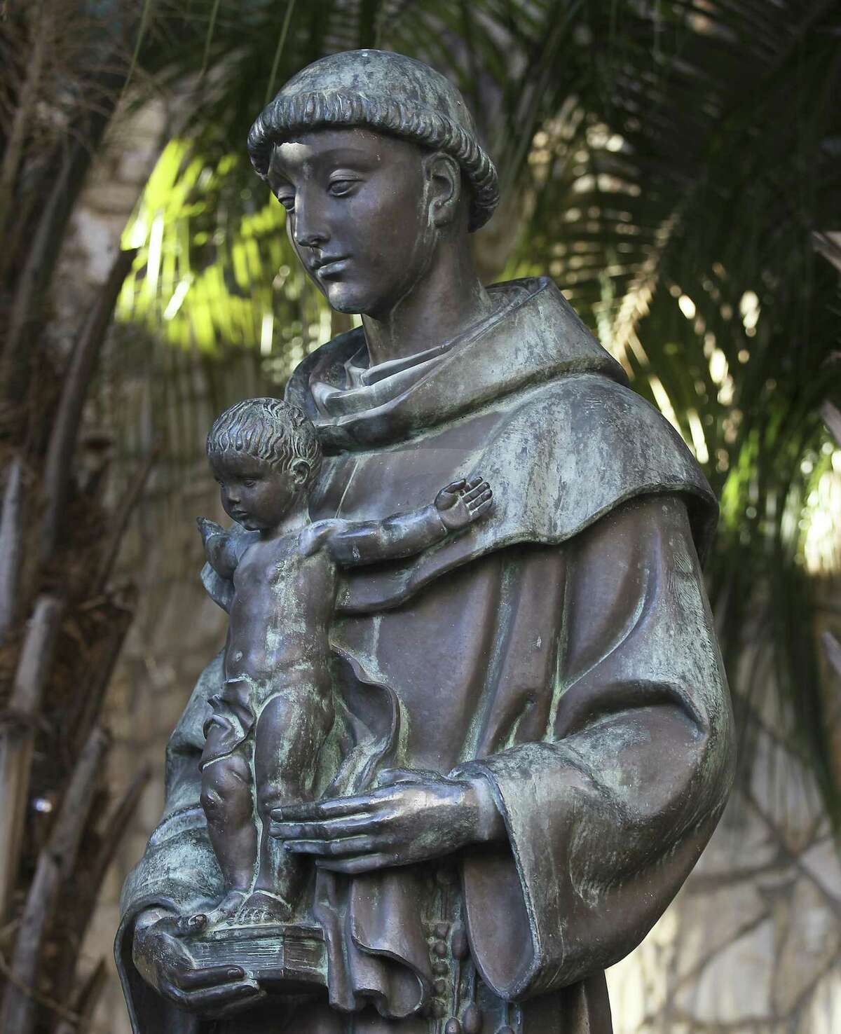 The statue of Saint Anthony of Padua along the River Walk. The seven-foot bronze statue was created by Portuguese sculptor Leopoldo de Almeida and presented to the city during the 1968 HemisFair. (Kin Man Hui/San Antonio Express-News)