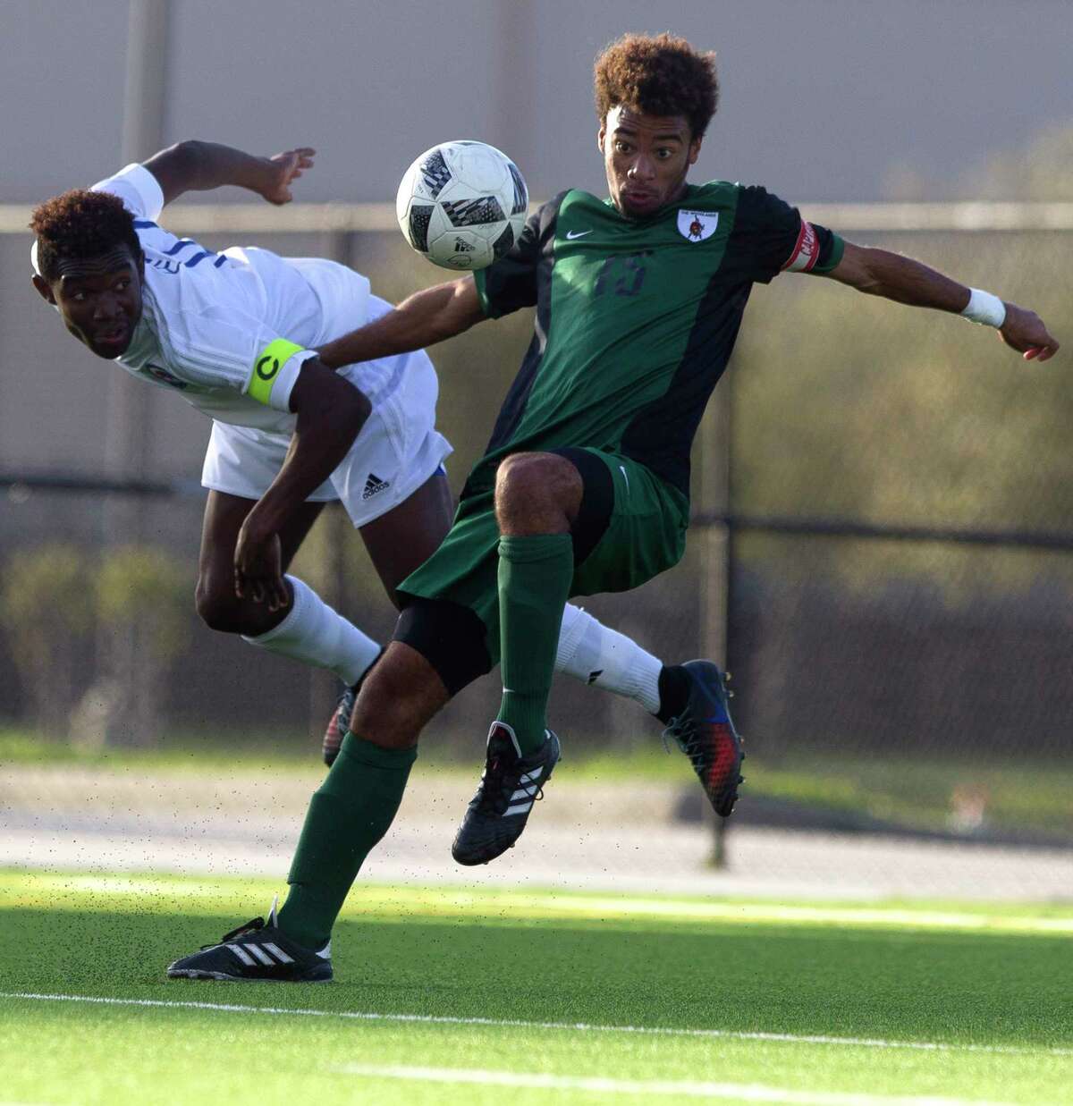 The Woodlands midfielder Wesley Mitchell (15) tries to control the ball in front of the goal against Oak Ridge midfielder Devonte Brown (10) during the first period of a District 12-6A high school boys soccer match at Woodforest Bank Stadium Thursday, March 2, 2017, in Conroe. The Woodlands defeated Oak Ridge 1-0.