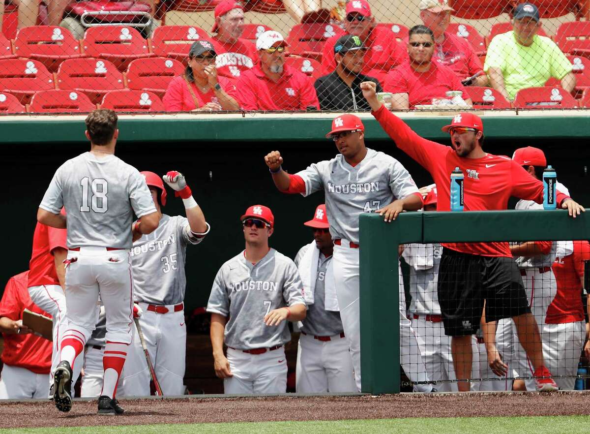 Houston outfielder Grayson Padgett (18) is greeted by teammates after scoring the first run during the NCAA baseball game between the Cincinnati Bearcats and the Houston Cougars at Schroeder Park on Saturday, May 20, 2017, in Houston, TX.