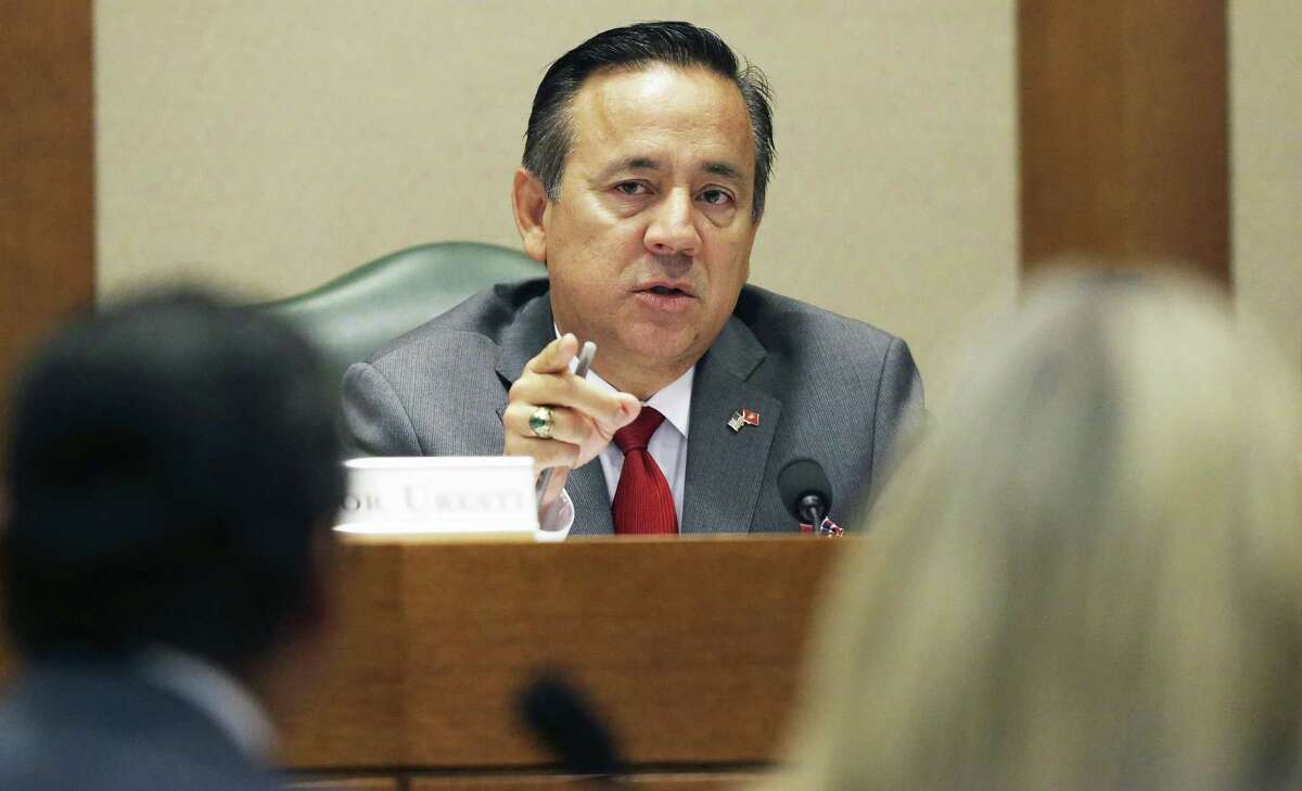 State Sen. Carlos Uresti hears testimony as he sits on the Education Committee at the Texas Capitol on Thursday, a day after being arrested on federal fraud and bribery charges.