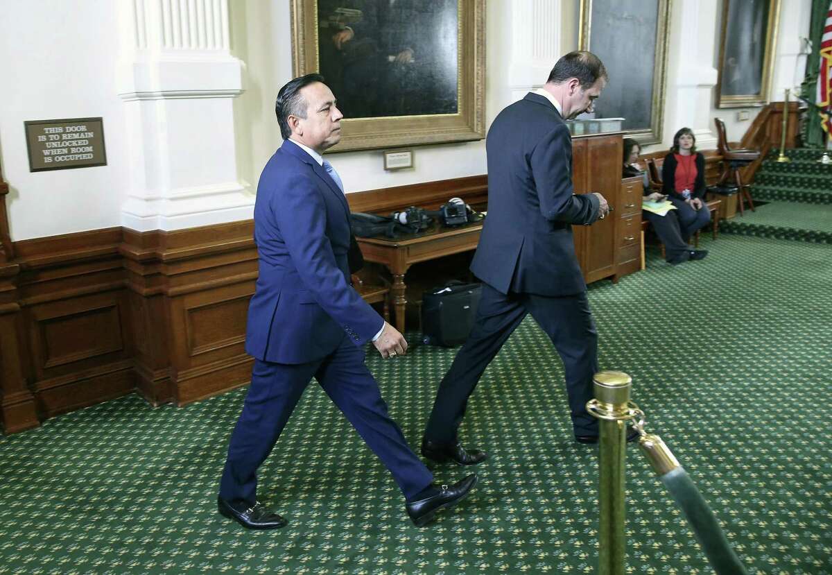 State Sen. Carlos Uresti makes it back to the floor of the Senate chamber after being arrested Wednesday morning to participate in the Senate Education Committee and Health and Human Services Committee meeting.
