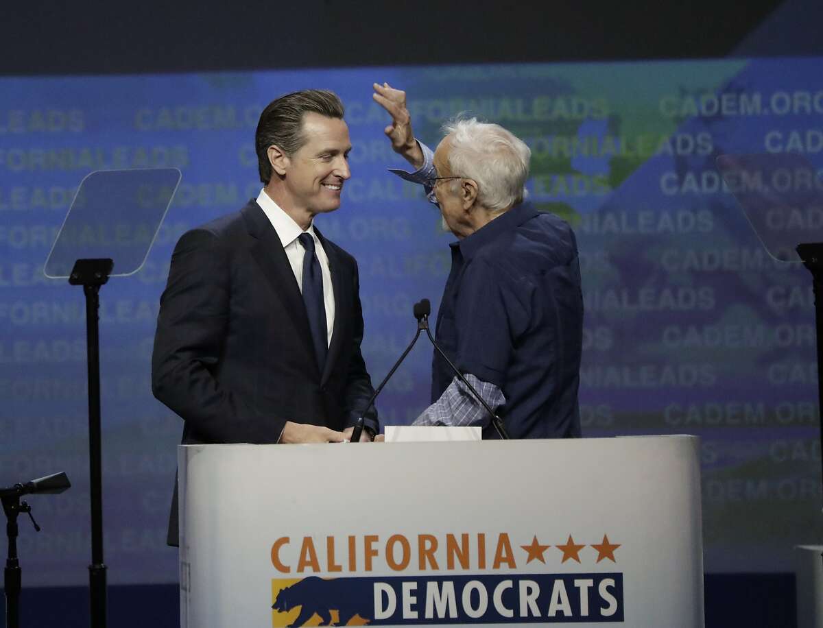 John Burton kiddingly tries to mess up Lt. Gov. Gavin Newsom's hair as he introduces him to the convention floor at the California Democrats 2017 State Convention on Saturday, May 20, 2017 in Sacramento, CA.