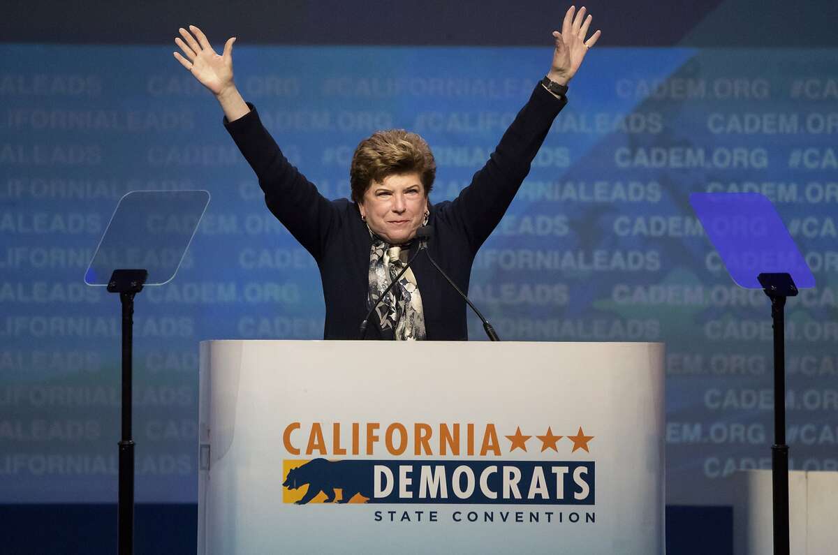 Delaine Eastin raises her arms after her speech at the California Democrats 2017 State Convention on Saturday, May 20, 2017 in Sacramento, CA.