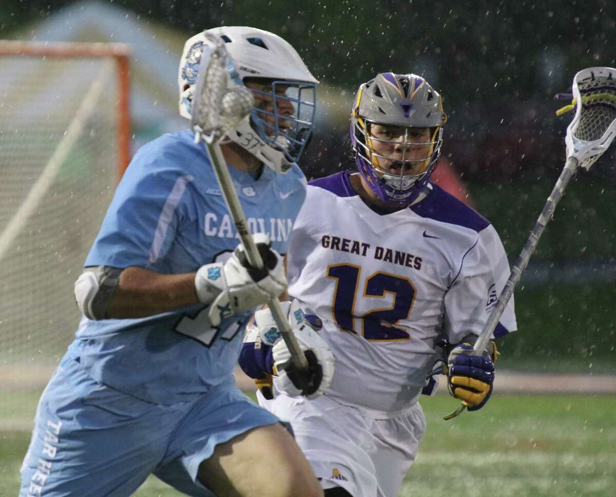 North Carolina's Austin Pifani moves the ball shadowed by UAlbany's Mitch Laffin during the first round of the NCAA Div 1 Men's Lacrosse Championship Saturday, May 13, 2017 at UAlbany's Casey Stadium. (Ed Burke photo - Special to The Times Union)