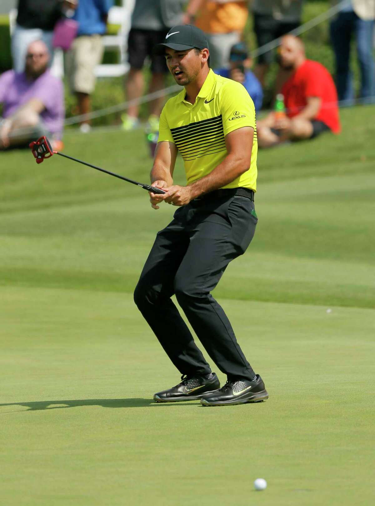 Jason Day, of Australia, reacts to missing a putt for birdie on the 18th green during the third round of the Byron Nelson golf tournament, Saturday, May 20, 2017, in Irving, Texas. (AP Photo/Tony Gutierrez)