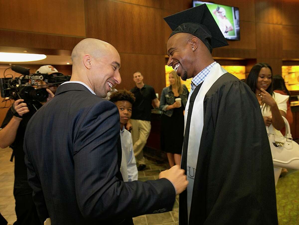 The UT athletic department held a reception for its 2017 graduates. Shaka Smart, left, didn't coach T.J. Ford, right, at Texas, but the connection is strong.