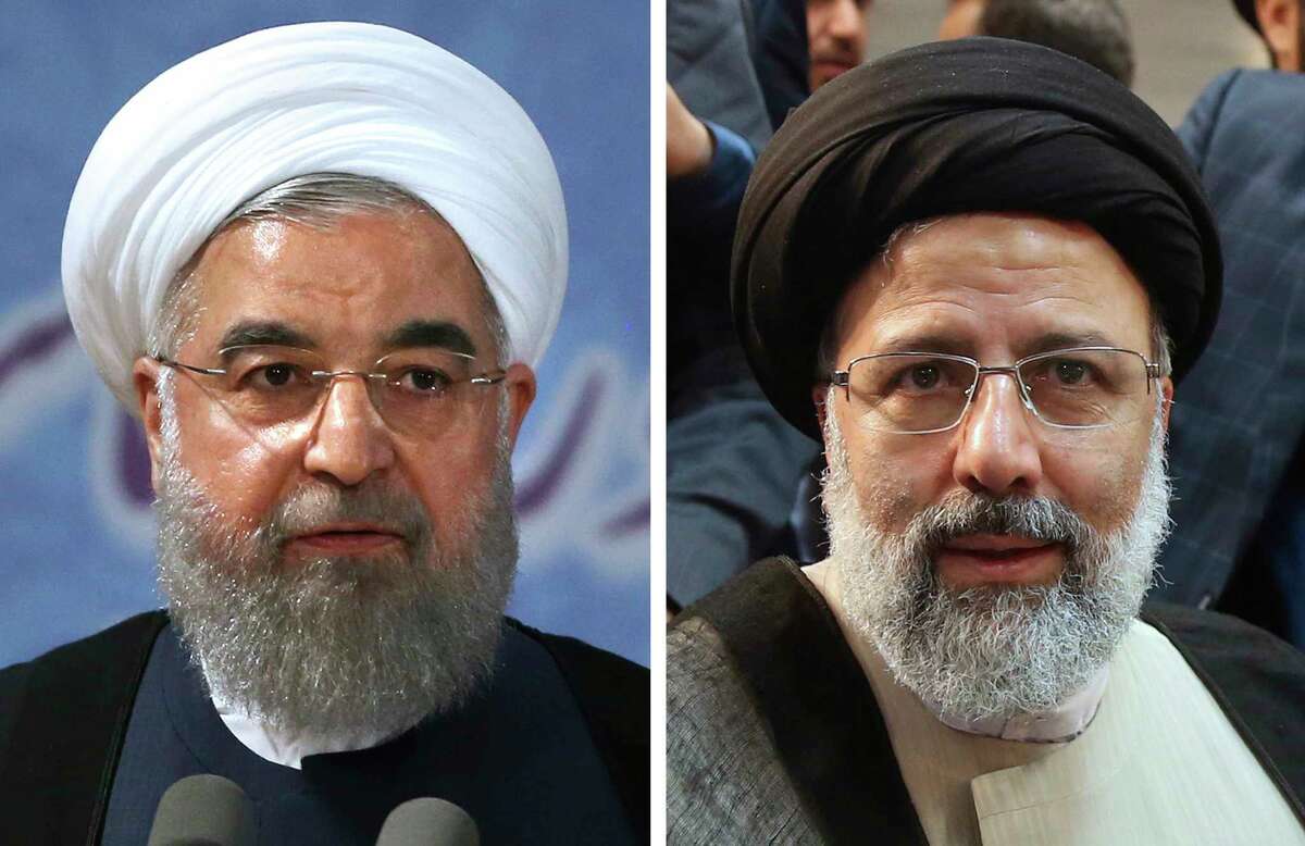 This combination of two Friday, April 14, 2017 file photos shows Iranian President Hassan Rouhani, left, and Iranian cleric Ebrahim Raisi when they register their candidacies for the May 19 presidential elections at the Interior Ministry in Tehran. Iran's state television declared incumbent President Rouhani the winner of the country's presidential election on Saturday, May 20, giving the 68-year-old cleric a second four-year term to see out his agenda calling for greater freedoms and outreach to the wider world. His nearest challenger was hard-line cleric Raisi, with 15.5 million votes. He is close to Ayatollah Ali Khamenei, Iran's supreme leader, who stopped short of endorsing anyone in the election. (AP Photo/Vahid Salemi, Files)