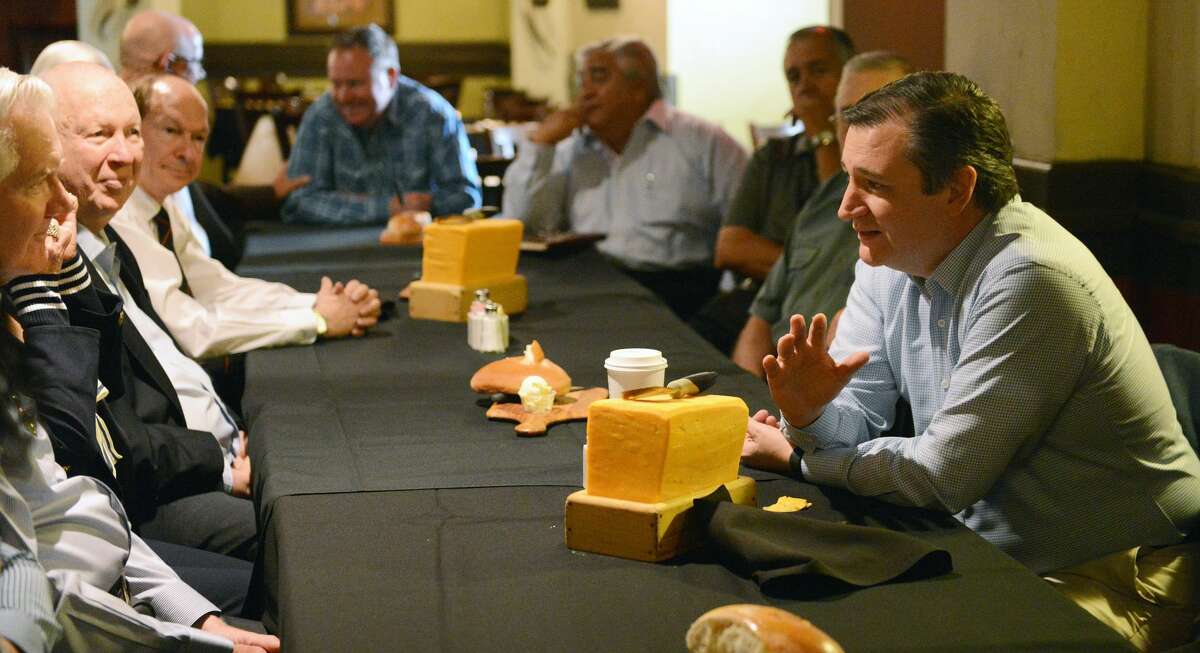 Sen. Ted Cruz, right, talks with local business, civic, and educational leaders during a luncheon meeting Saturday at the Barn Door. Sen. Cruz later met with leaders from Midland during a stop at the airport.