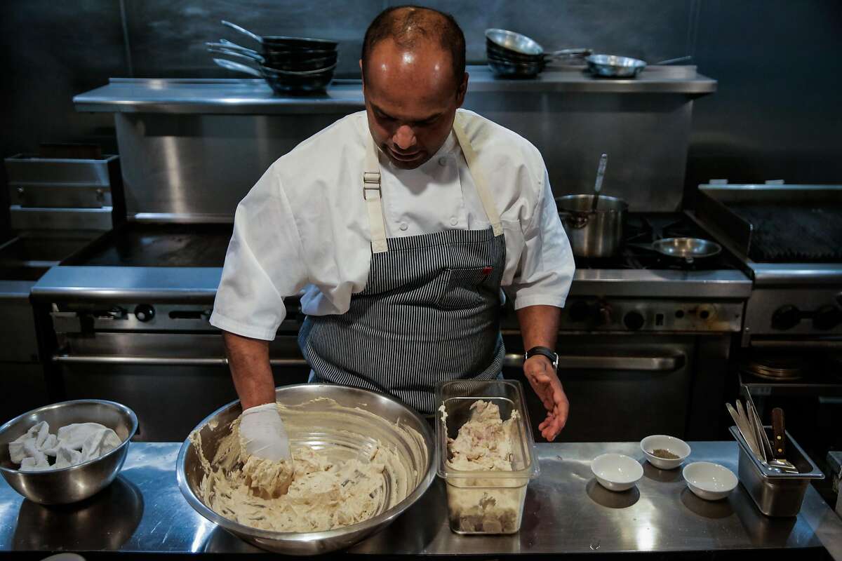 Chef Rupam Bhagat makes a marinade for a grilled lamb dish at Dum Indian Restaurant in San Francisco, California, on Monday, May 8, 2017.