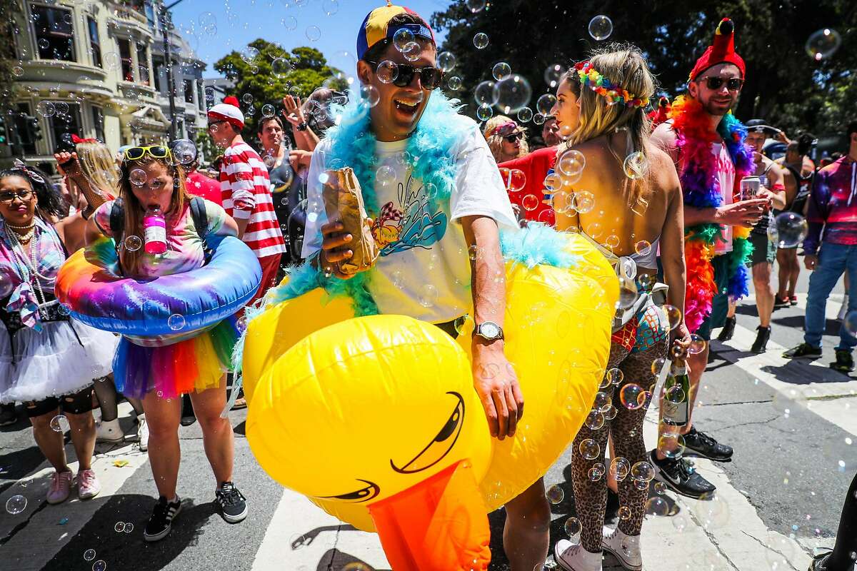 Remi Fernandez laughed as he played with bubbles on Fell Street during the Bay to Breakers annual race in San Francisco, California, on Sunday, May 21,2017.