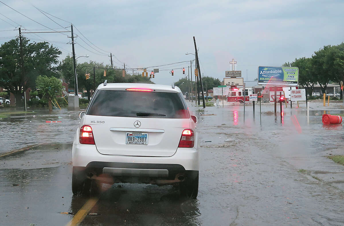 A Fire Department unit crosses a flooded intersection at Hillside Road and Springfield Avenue as a severe storm swept through the area Sunday, May 21, 2017. The storm brought heavy rain, hail and strong wind gusts.