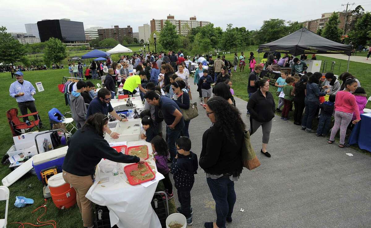 Families check out various stations of crafts and experiments during the fourth annual STEMFest at Mill River Park in Stamford, Conn. on May 20, 2017. The free, day-long festival by Stamford Public Schools, featured hands-on science, technology, engineering and math activities for all ages.