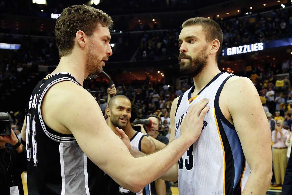 Pau and Marc Gasol greet each other after the Spurs won Game 6 on April 27.