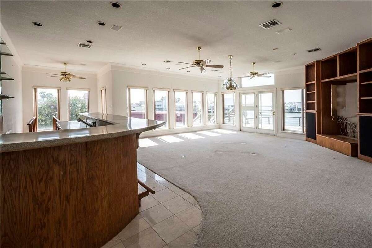 Gallery Tiki Island home with giant deck overlooking Galveston’s West