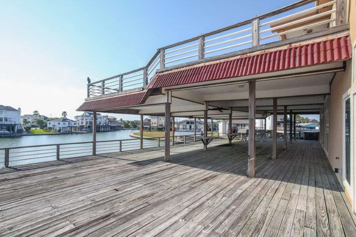 Gallery Tiki Island home with giant deck overlooking Galveston’s West