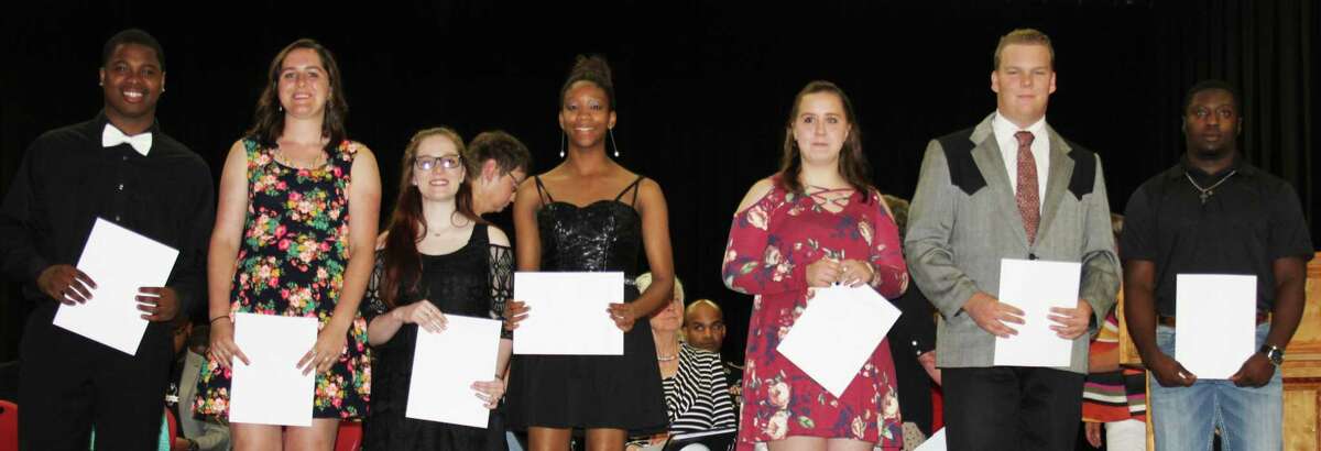 The recipients of the Amber Grace Basye Fly High scholarship, left to right: De'Ondre Blanks, Emily Ruesewald, Lindsey Landrum, Migaria Brandley, Katelynn Johnson, Deaven Fussell and Don Taylor.
