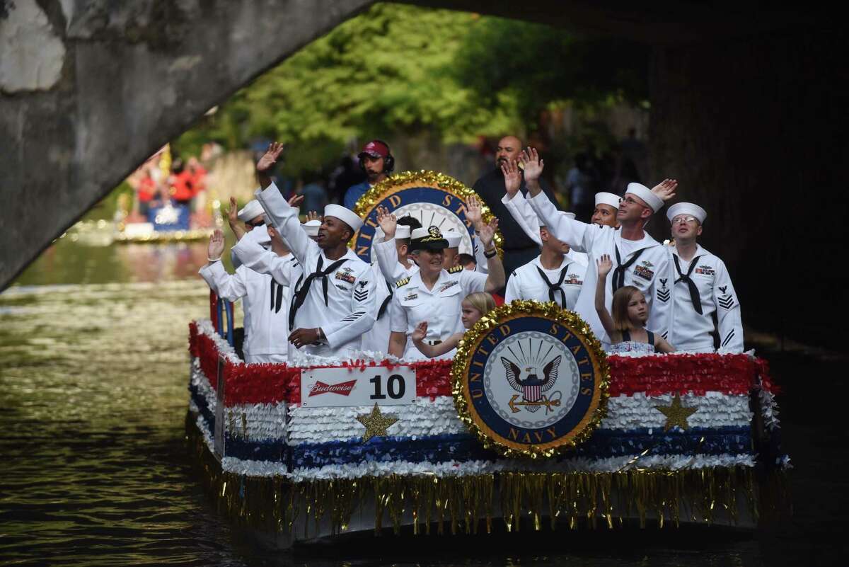 Navy personnel man their float during the Armed Forces River Parade on the Riverwalk on Saturday, May 20, 2017. Loretta Swit, who played Major Margaret Houlihan on the television show M*A*S*H, was the grand marshal of the event, which featured 26 military-themed floats.