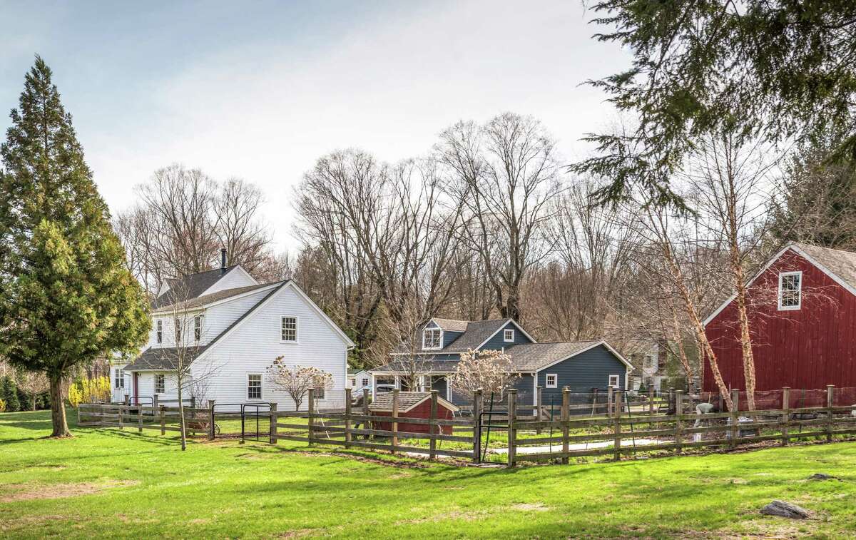 The property once known as the historic Sherwood Family Farm has a main house, guest cottage, original red English barn, a chicken coop and accommodations for horses.