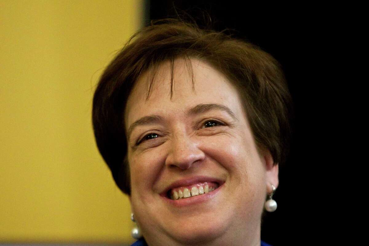 In this May 26, 2010, photo, Supreme Court nominee Elena Kagan smiles on Capitol Hill in Washington, before her meeting with Jeff Merkley, D-Ore. Kagan's review of the book "A Confirmation Mess" is creating a confirmation mess of its own. Kagan's 1995 commentary on Stephen Carter's book rendered a harsh judgment on how lawmakers question Supreme Court nominees, and that has some senators preparing to interrogate her about it. (AP Photo/Drew Angerer)