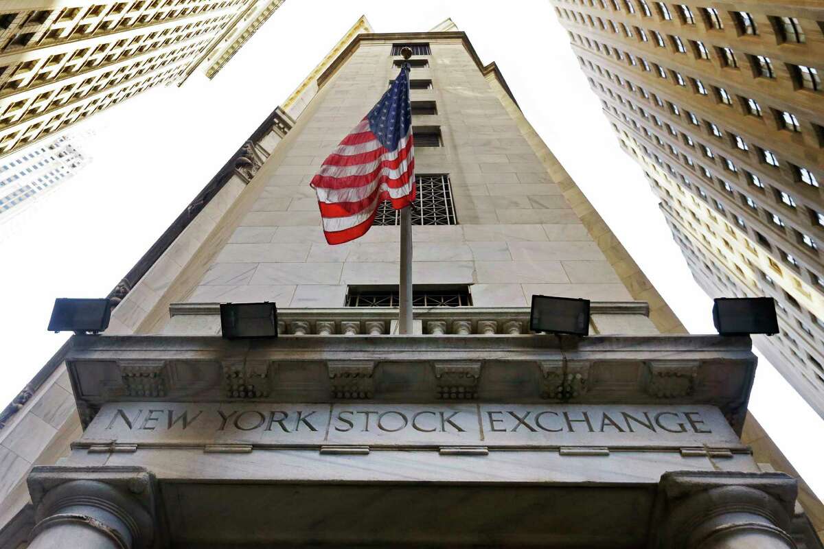FILE - In this Friday, Nov. 13, 2015, file photo, the American flag flies above the Wall Street entrance to the New York Stock Exchange. U.S. stocks are broadly higher early Monday, May 22, 2017, as the market bounces back from a turbulent week. Defense contractors are making some of the largest gains and materials makers, technology and consumer-focused companies are all rising. Ford is up after it replaced CEO Mark Fields, while chemicals maker Huntsman is rising after it agreed to combine with Swiss competitor Clariant. (AP Photo/Richard Drew, File)
