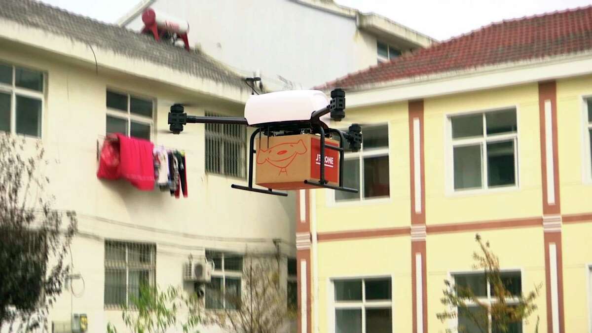 ﻿A drone takes off to deliver a JD.com parcel from a village﻿ in China. JD.com says its planned drone delivery network in Shaanxi would cover a ﻿200-mile radius and have drone air bases throughout the province. ﻿