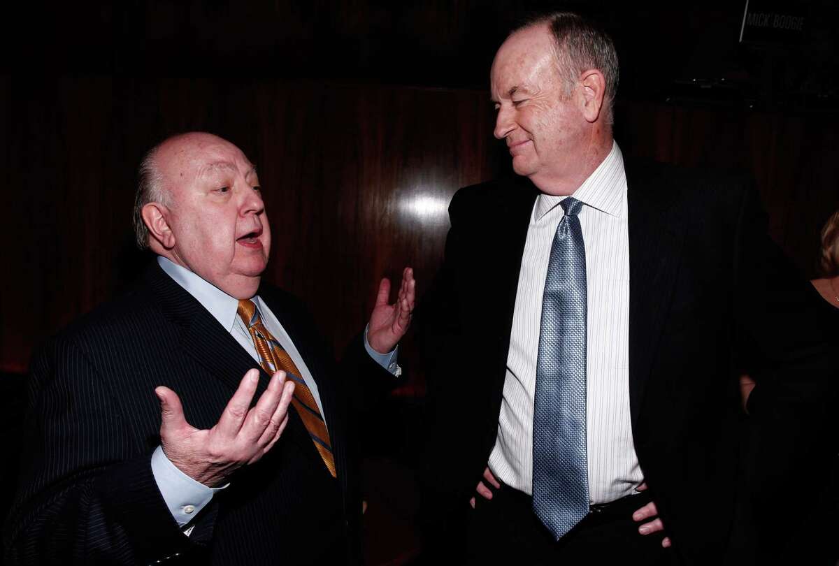 Roger Ailes, left, and Bill OReilly appear at a Hollywood Reporter event in 2012. Unresolved lawsuits related to Ailes and fired prime-time host O'Reilly are contributing to uncertainty about the network's management.