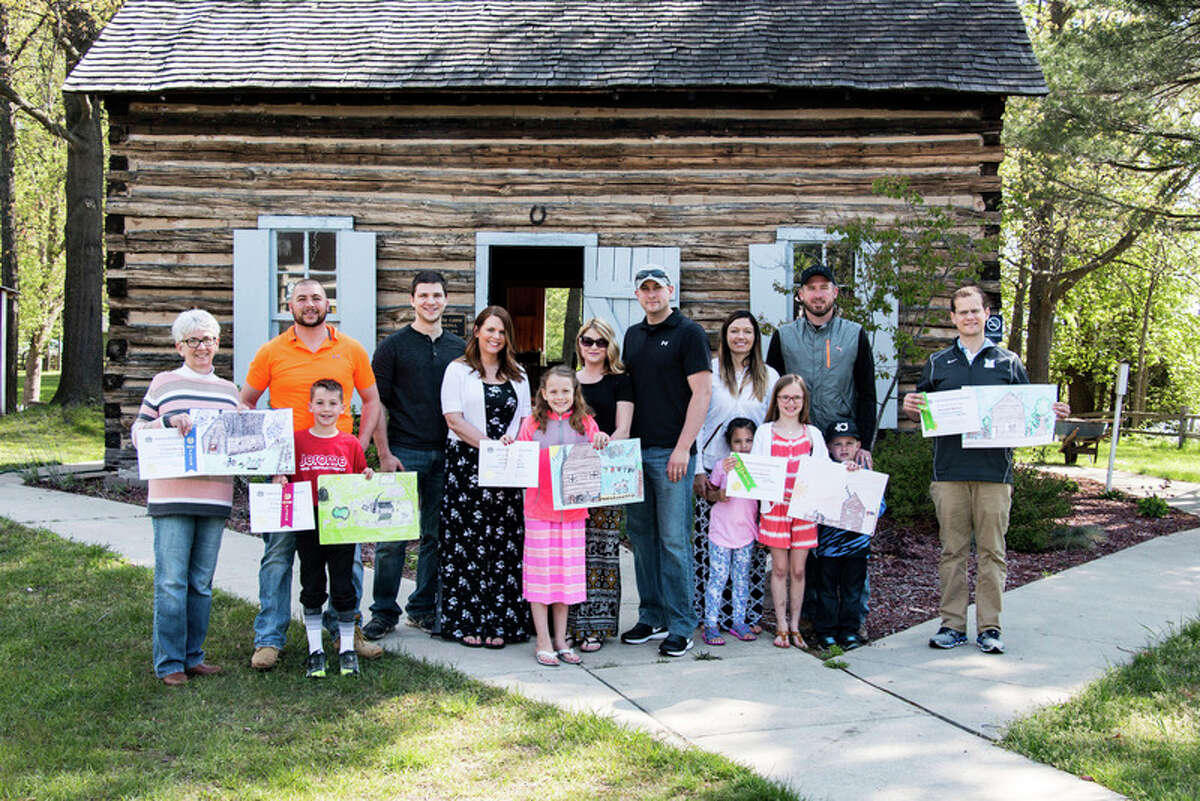 The Sanford Centennial Museum recently hosted the 2017 Log Cabin Day Art Contest. Pictured are the winners, all second graders from Meridian Elementary School, and their parents.