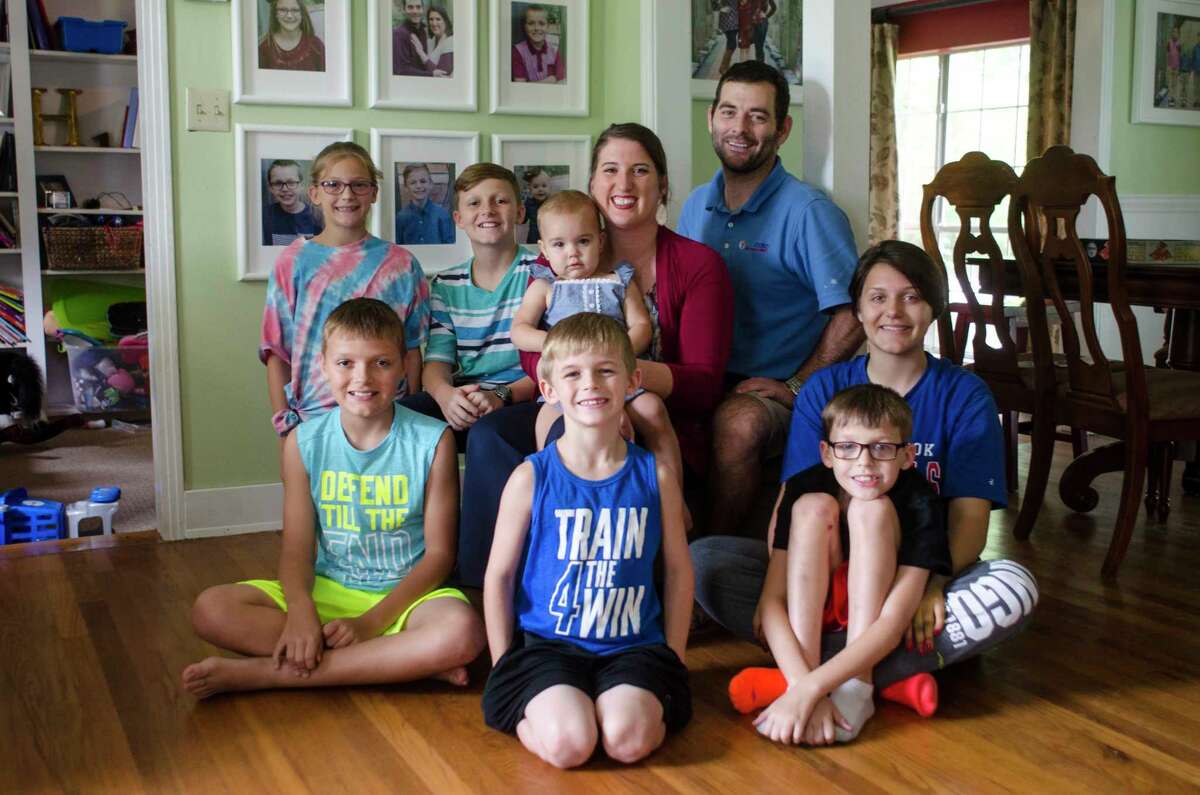 Scott and Amber Hawk gained their one-year-old granddaughter, Kaydence, in 2016 when they adopted four of their seven children. The Hawks first started adopting, through foster care, in 2014.Â Photo taken Monday May 22, 2017 Sara E. Flores/The Enterprise