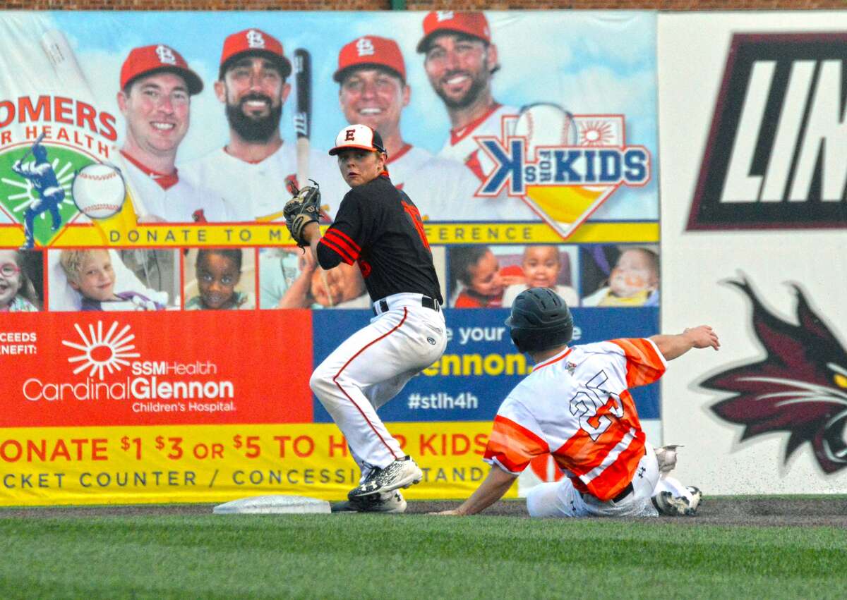 Edwardsville shortstop Joel Quirin, left, attempts to complete a double play in the first inning of Monday’s game against Waterloo at GCS Stadium in Sauget.