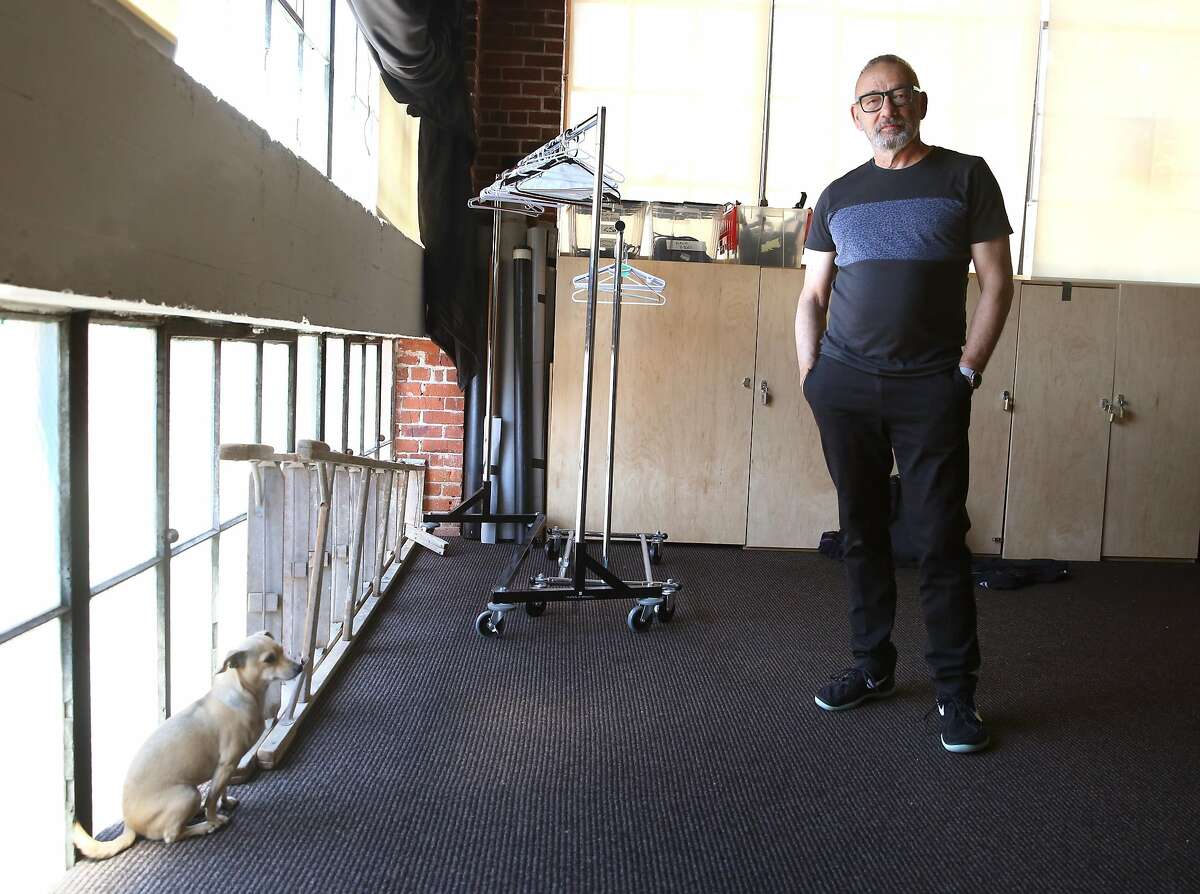 Choreographer Joe Goode in the storage room with his dog Macha on Monday, May 22, 2017, in San Francisco, Calif.